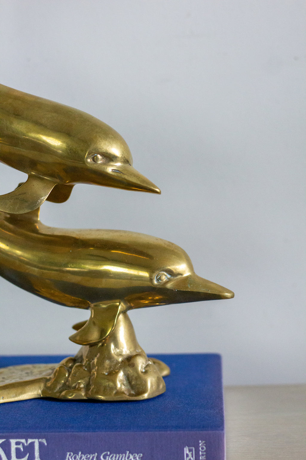Vintage brass dolphins