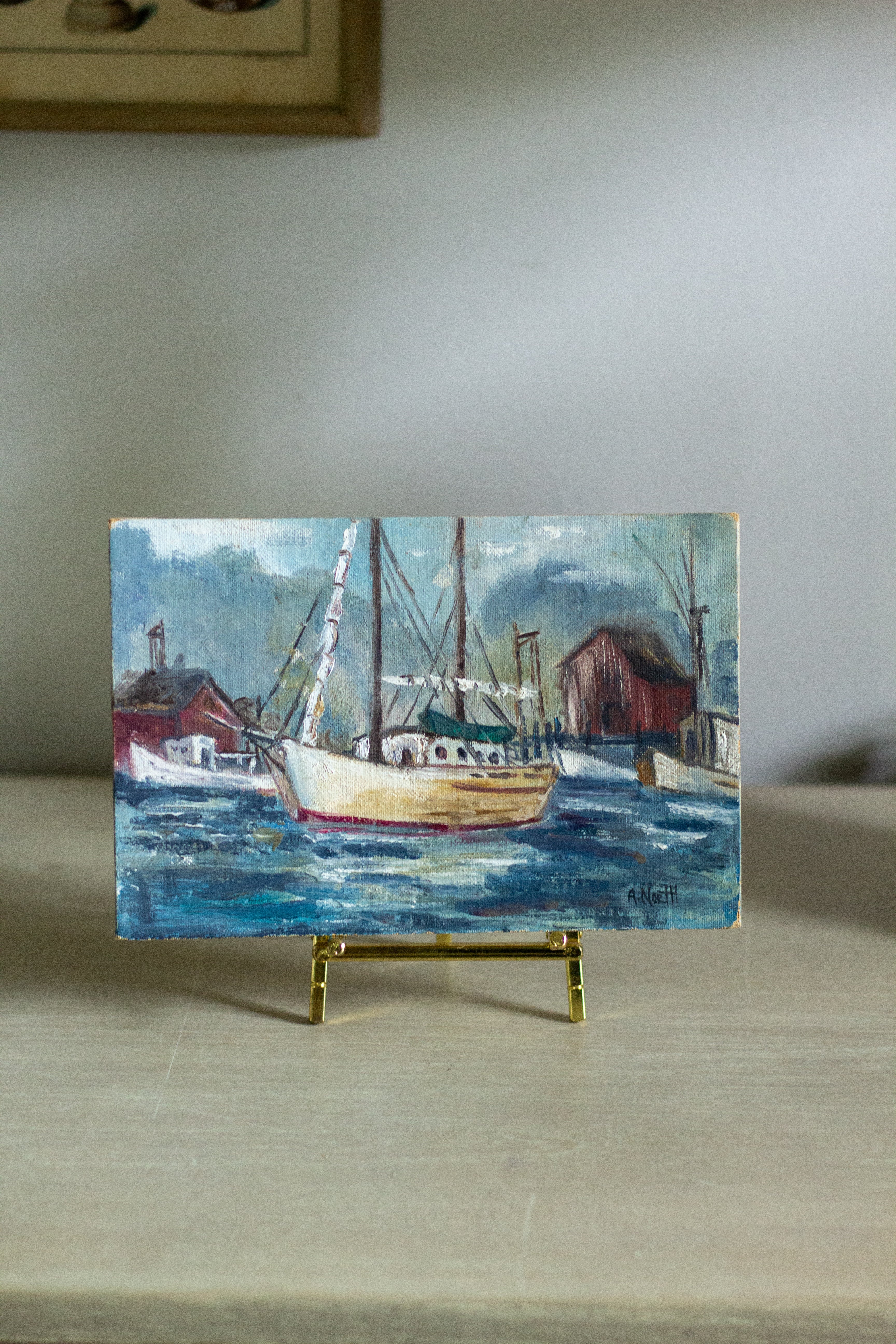 Small vintage fishing boat painting