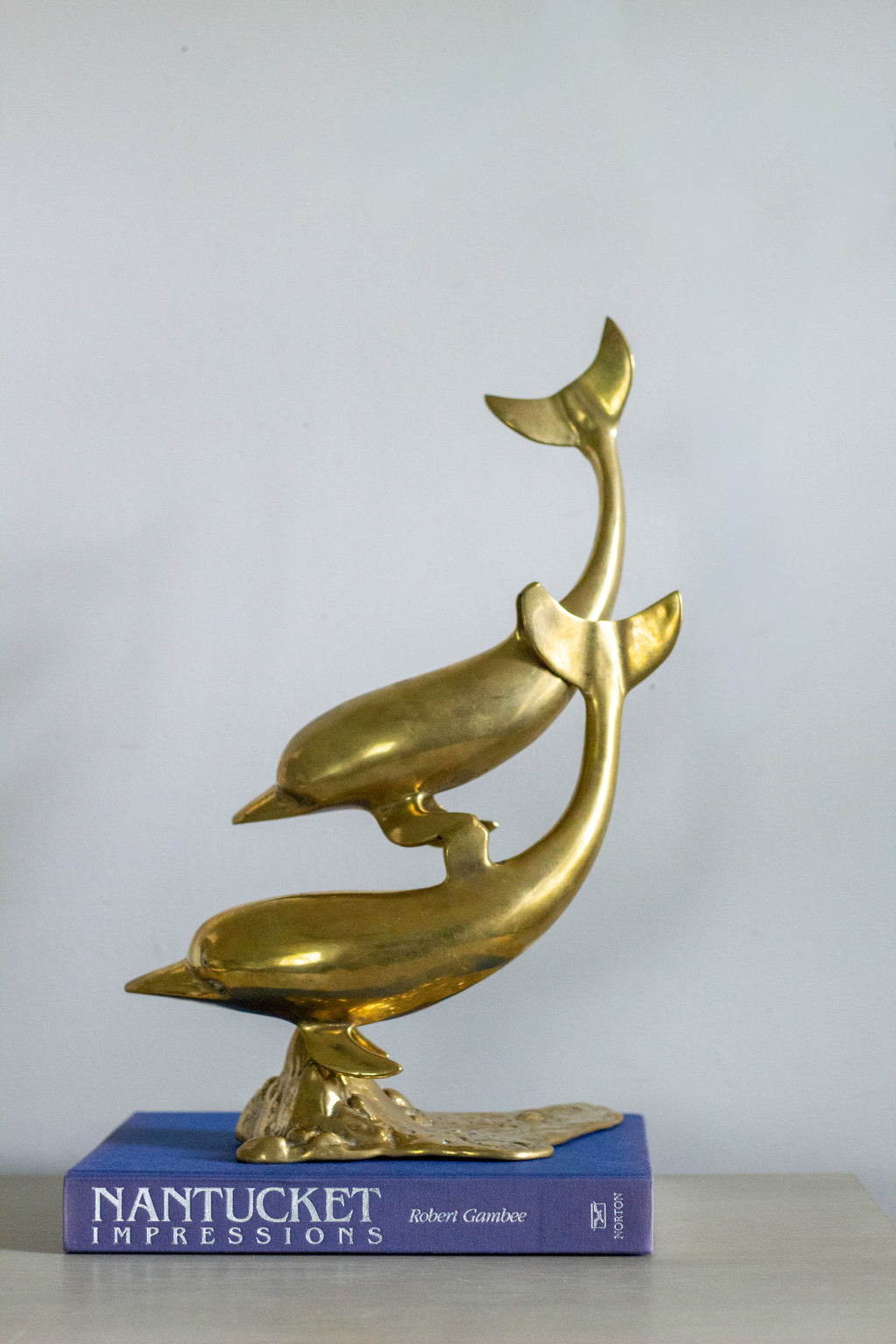 Vintage brass dolphins