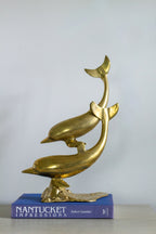 Vintage brass dolphins
